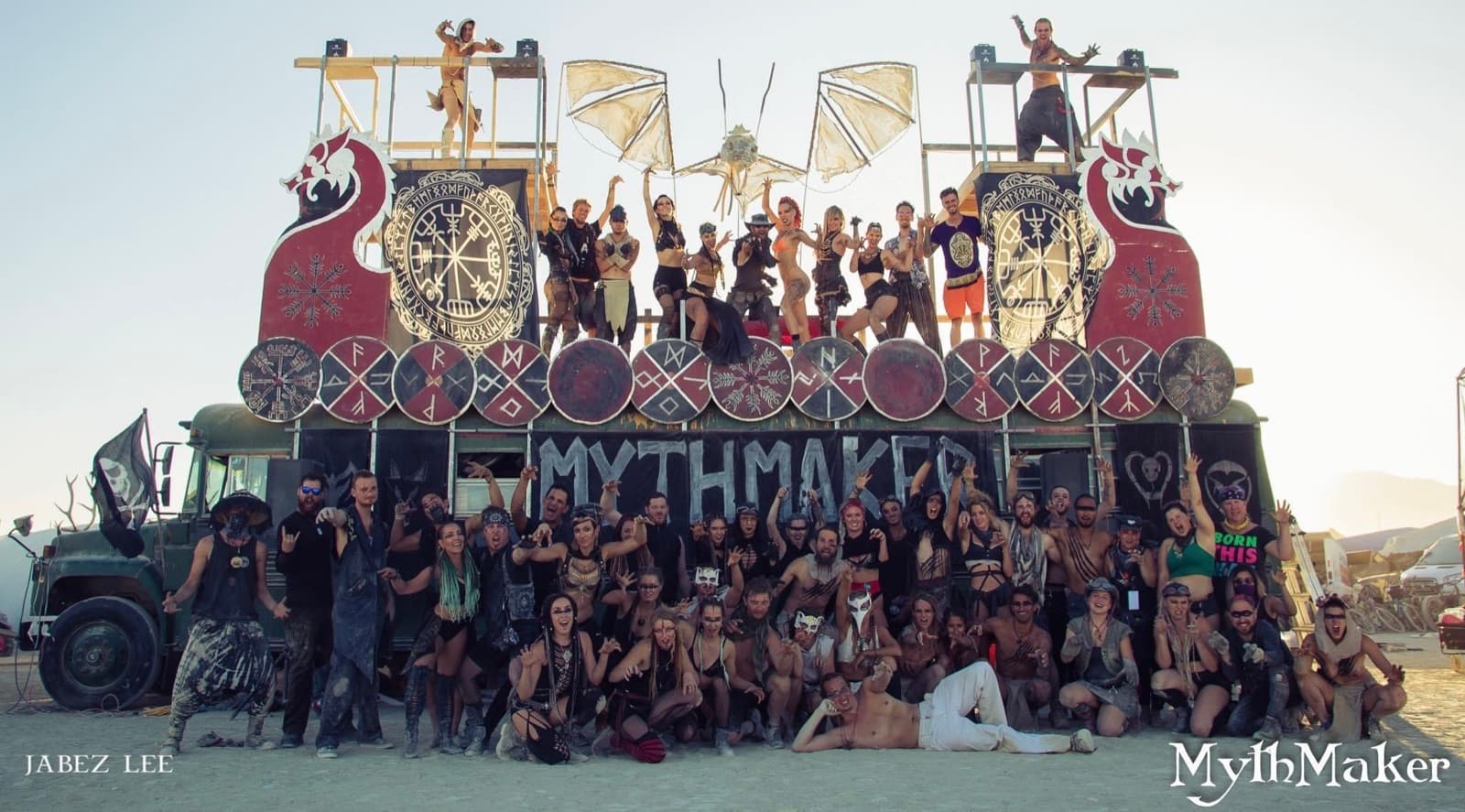 The hundred-strong Camp MythMaker gathered on their dragon-prowed bus at Burning Man